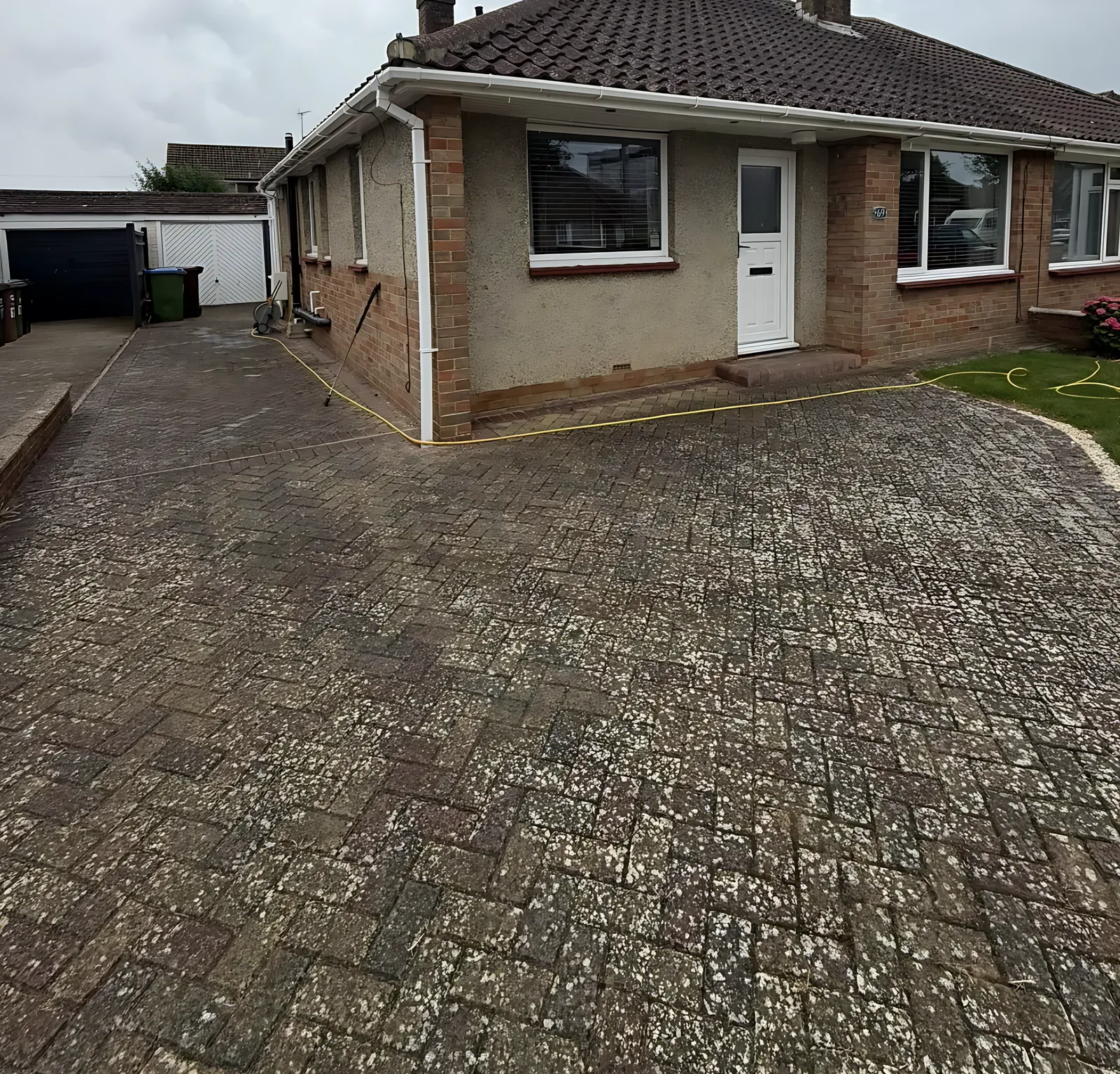 Block paving driveway before cleaning