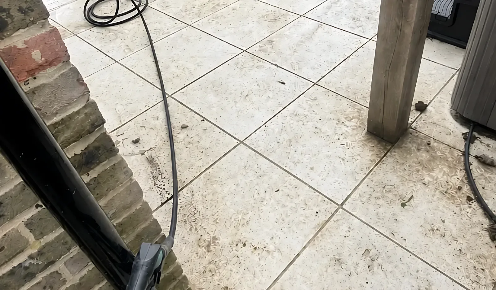 Porcelain patio with dirty joints before cleaning