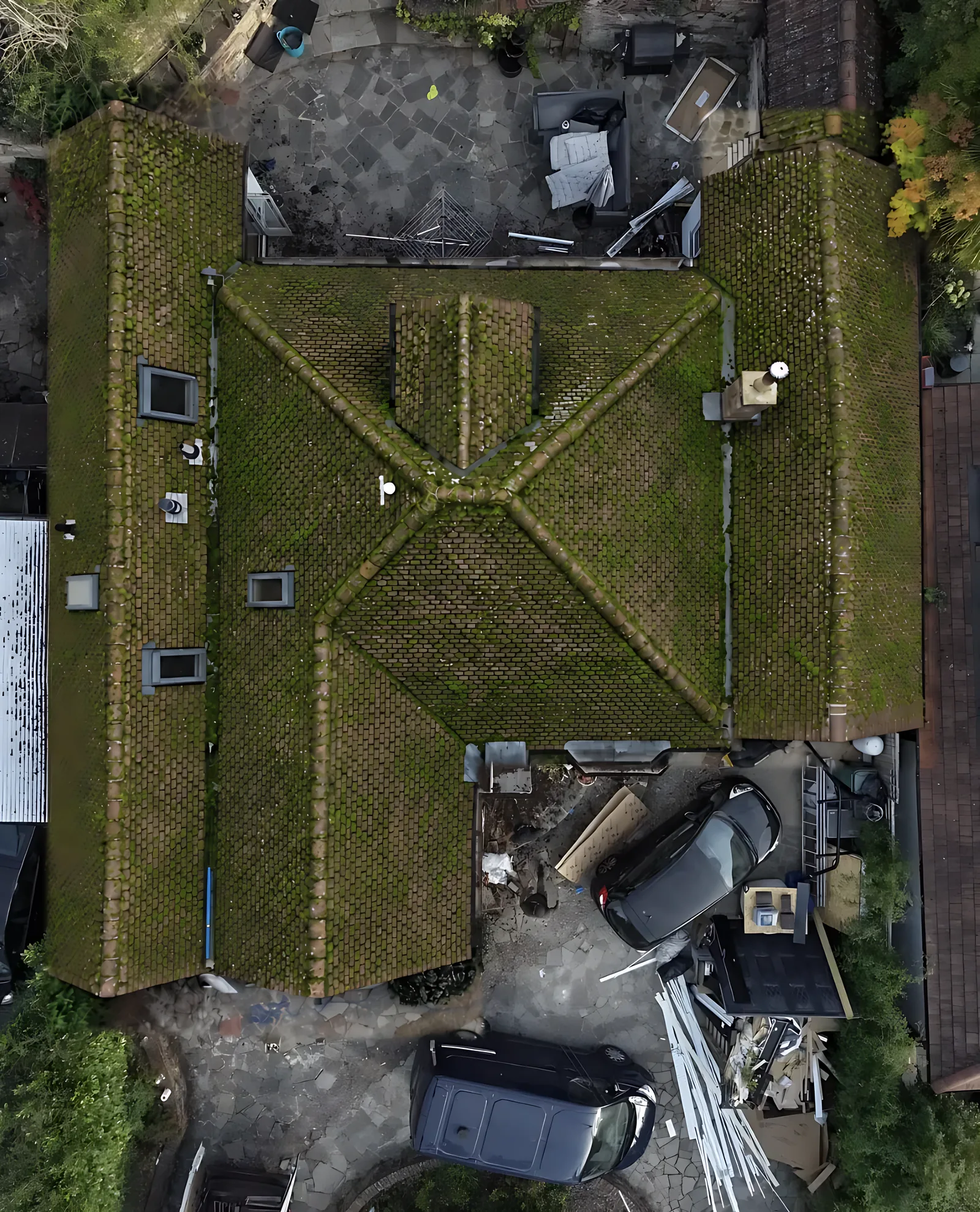Hipped roof covered in moss from above