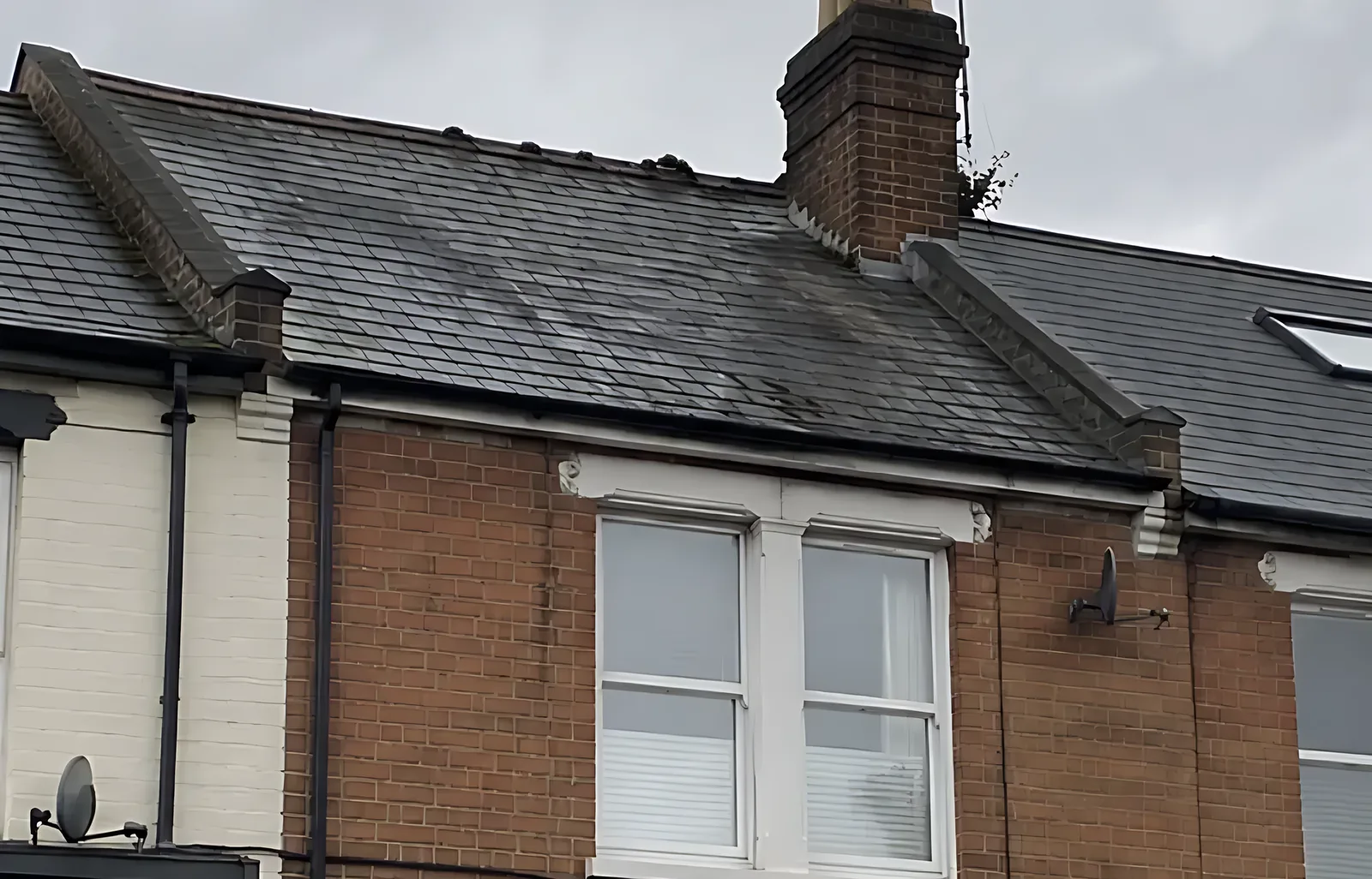 Terraced house roof and gutter after cleaning